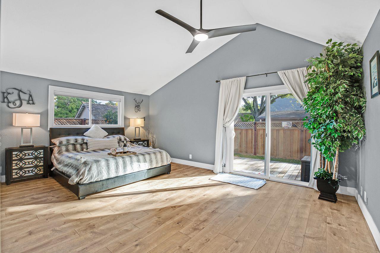 17745 Park Way Morgan Hill, CA 95037 - Photo 14 of 36 a spacious bedroom with a bed and a potted plant