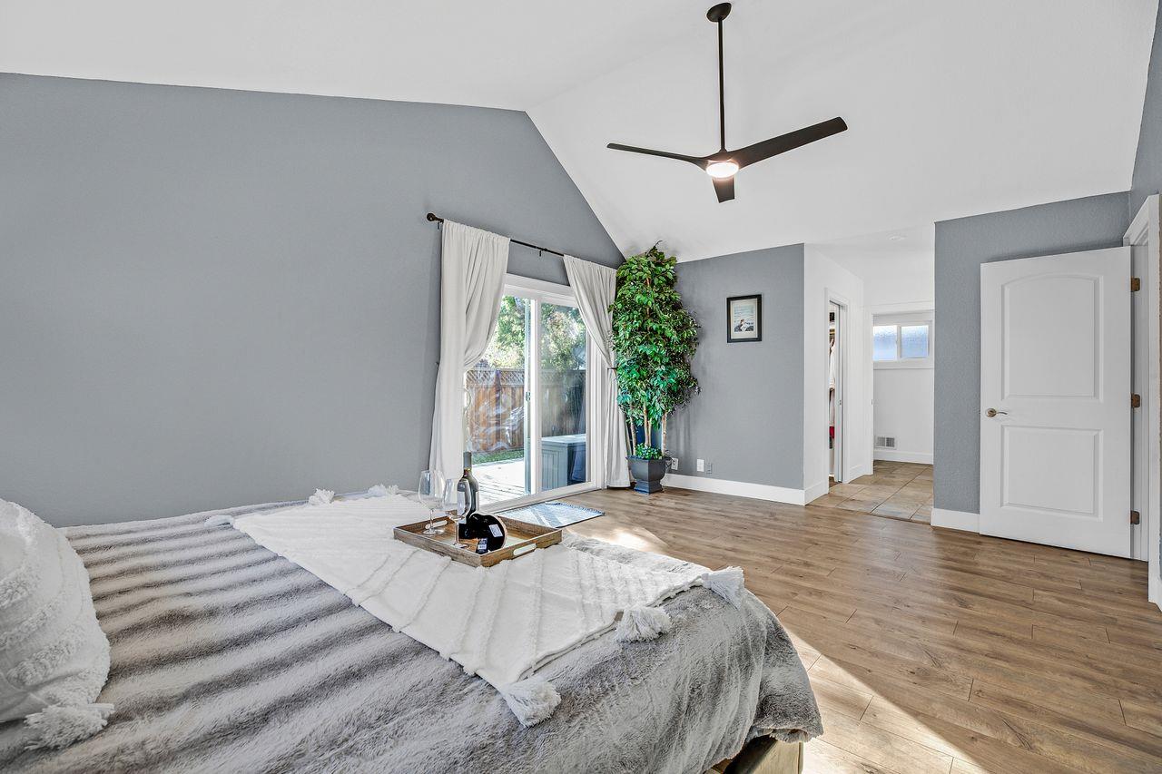 17745 Park Way Morgan Hill, CA 95037 - Photo 16 of 36 a view of a bedroom with a bed and wooden floor