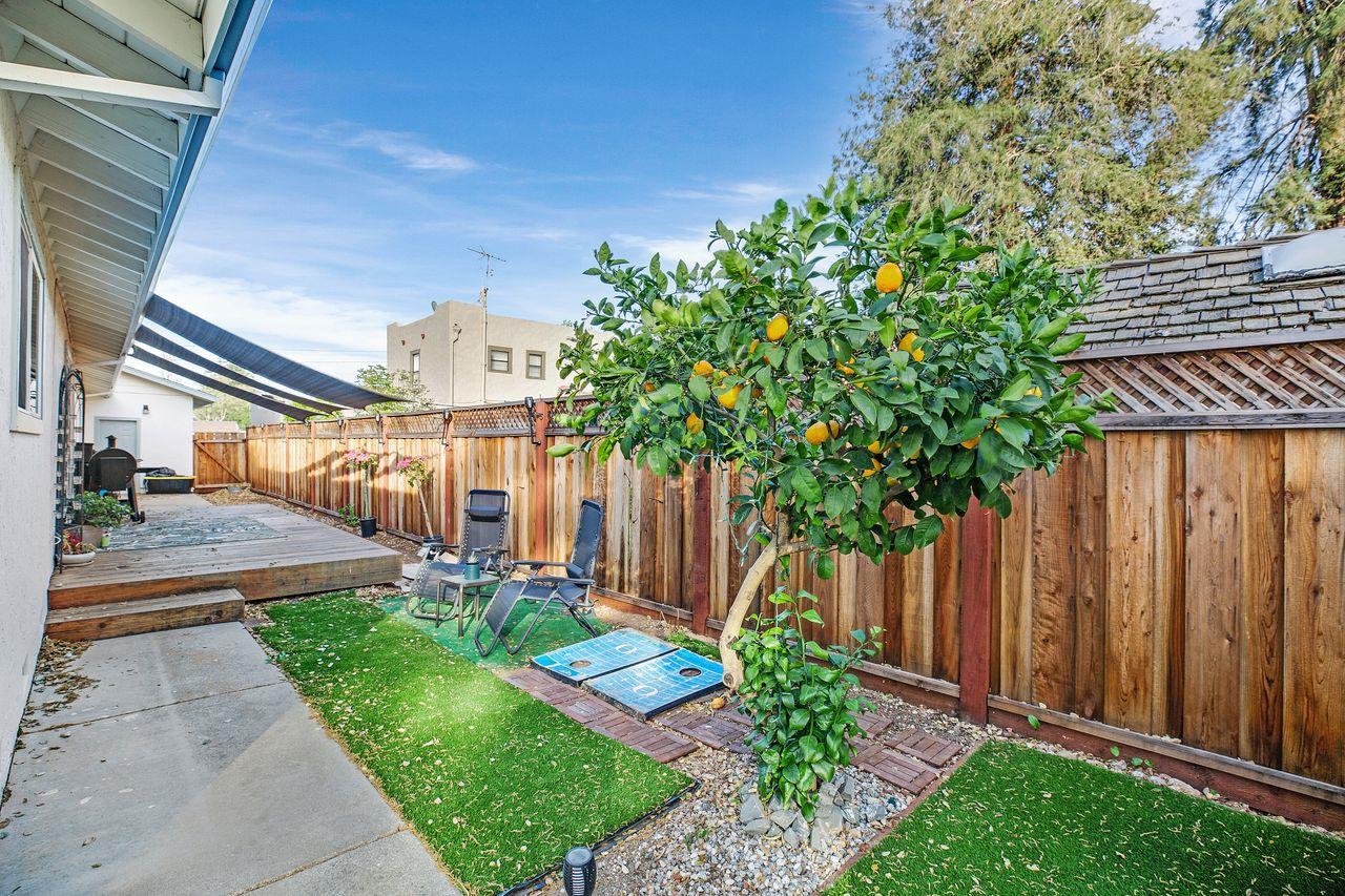 17745 Park Way Morgan Hill, CA 95037 - Photo 35 of 36 a front view of a house with a yard and table and chairs