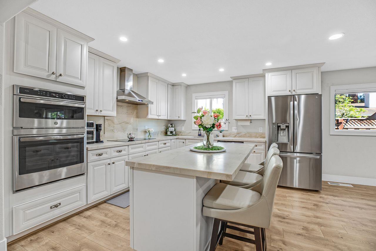 17745 Park Way Morgan Hill, CA 95037 - Photo 4 of 36 a kitchen with refrigerator cabinets and wooden floor