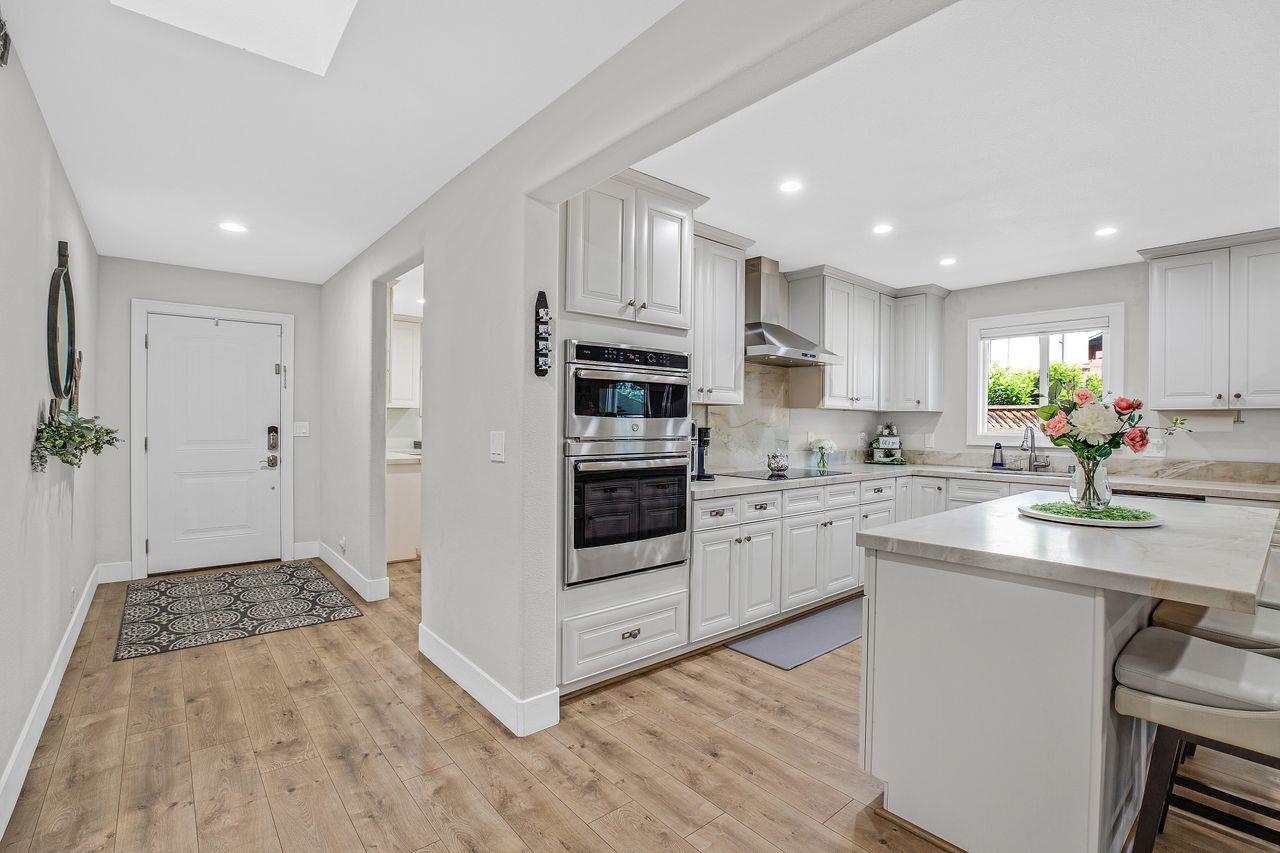 17745 Park Way Morgan Hill, CA 95037 - Photo 6 of 36 a kitchen with white cabinets and white appliances