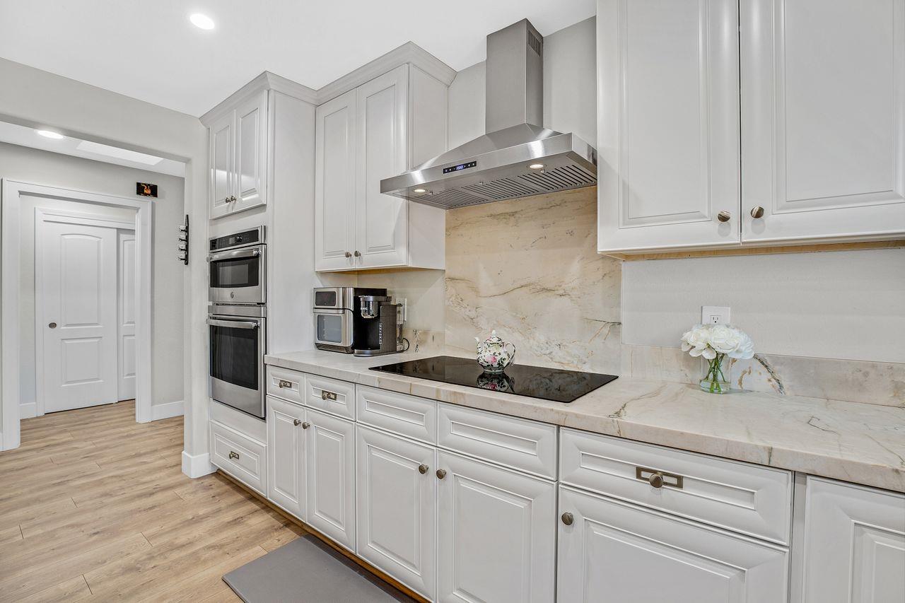 17745 Park Way Morgan Hill, CA 95037 - Photo 7 of 36 a kitchen with stainless steel appliances white cabinets and a sink