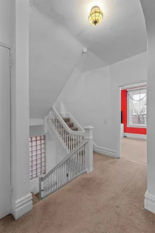 a view of an entryway door with stairs