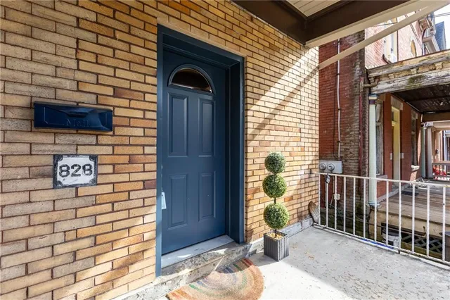 a view of a door and chair in the balcony