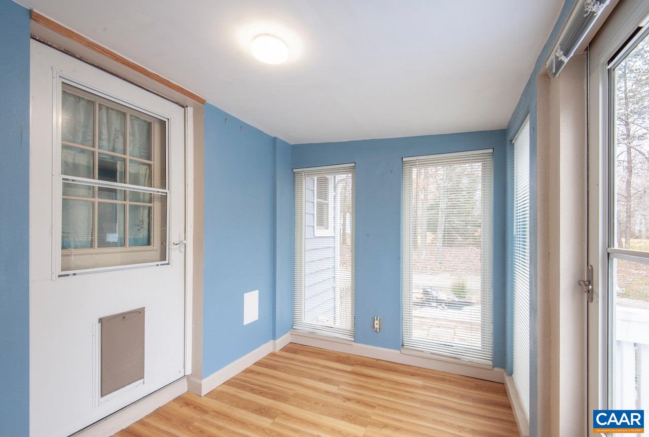 1358 Craigtown Road Shipman, VA 22971 - Photo 26 of 38 a view of an empty room with wooden floor and a window