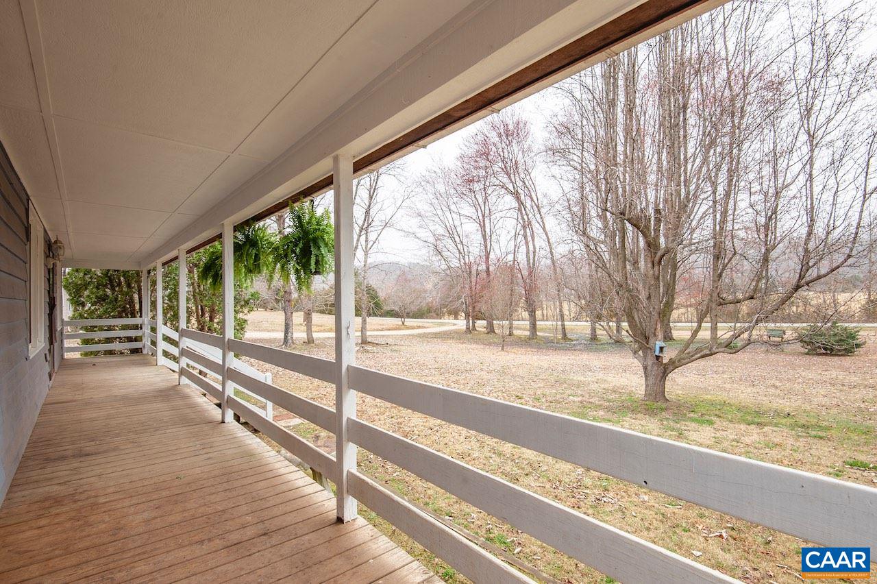 1358 Craigtown Road Shipman, VA 22971 - Photo 3 of 38 a view of a yard and deck with wooden floor and fence