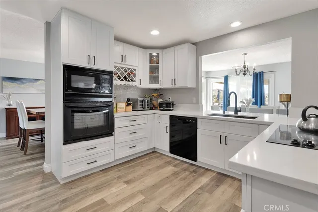 a kitchen with stainless steel appliances a stove microwave and cabinets
