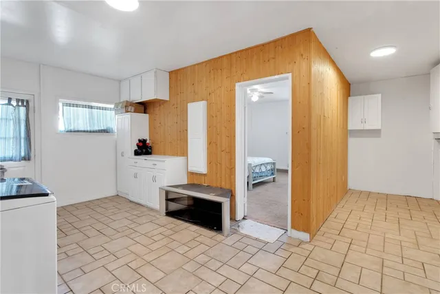a spacious bathroom with a sink and a mirror