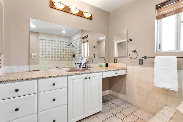 a view of a living room and kitchen