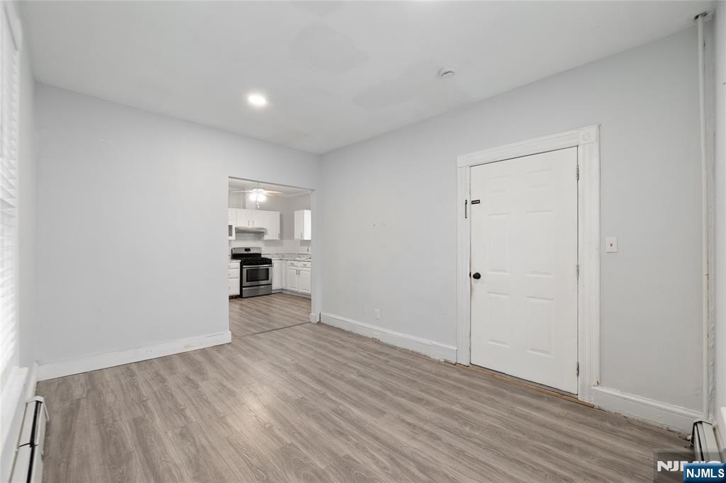 580 Monroe Avenue, Unit 1 Elizabeth, NJ 07201 - Photo 2 of 10 a view of a big room with wooden floor and windows