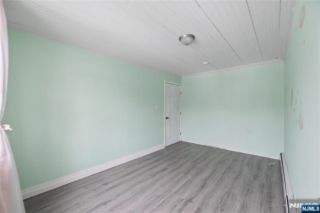 580 Monroe Avenue, Unit 1 Elizabeth, NJ 07201 - Photo 9 of 10 a view of room with wooden floor