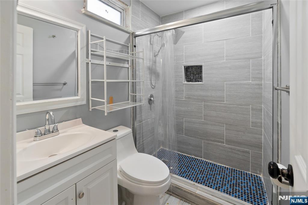 580 Monroe Avenue, Unit 1 Elizabeth, NJ 07201 - Photo 10 of 10 a bathroom with a sink toilet and shower