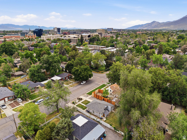 225 South 300 East Provo, UT 84606 - Photo 27 of 30 Aerial perspective showcasing a residential area with mature trees and mountain backdrops