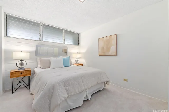 a bedroom with a bed and chair