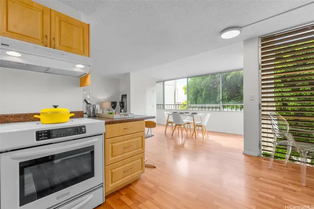 a kitchen with a stove a sink and a microwave
