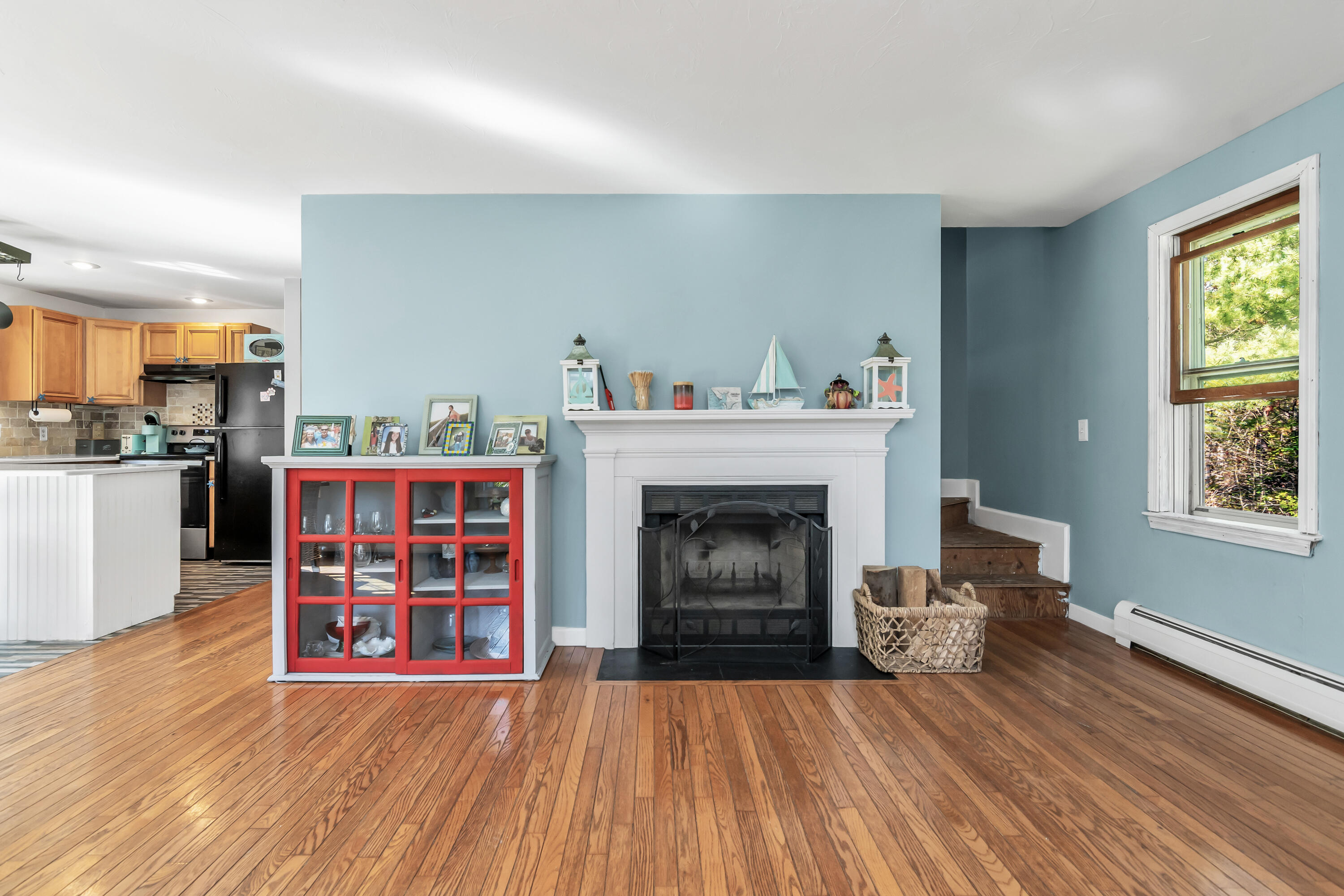 76 Trout Brook Road Mashpee, MA 02649 - Photo 11 of 43 a living room with furniture and a fireplace