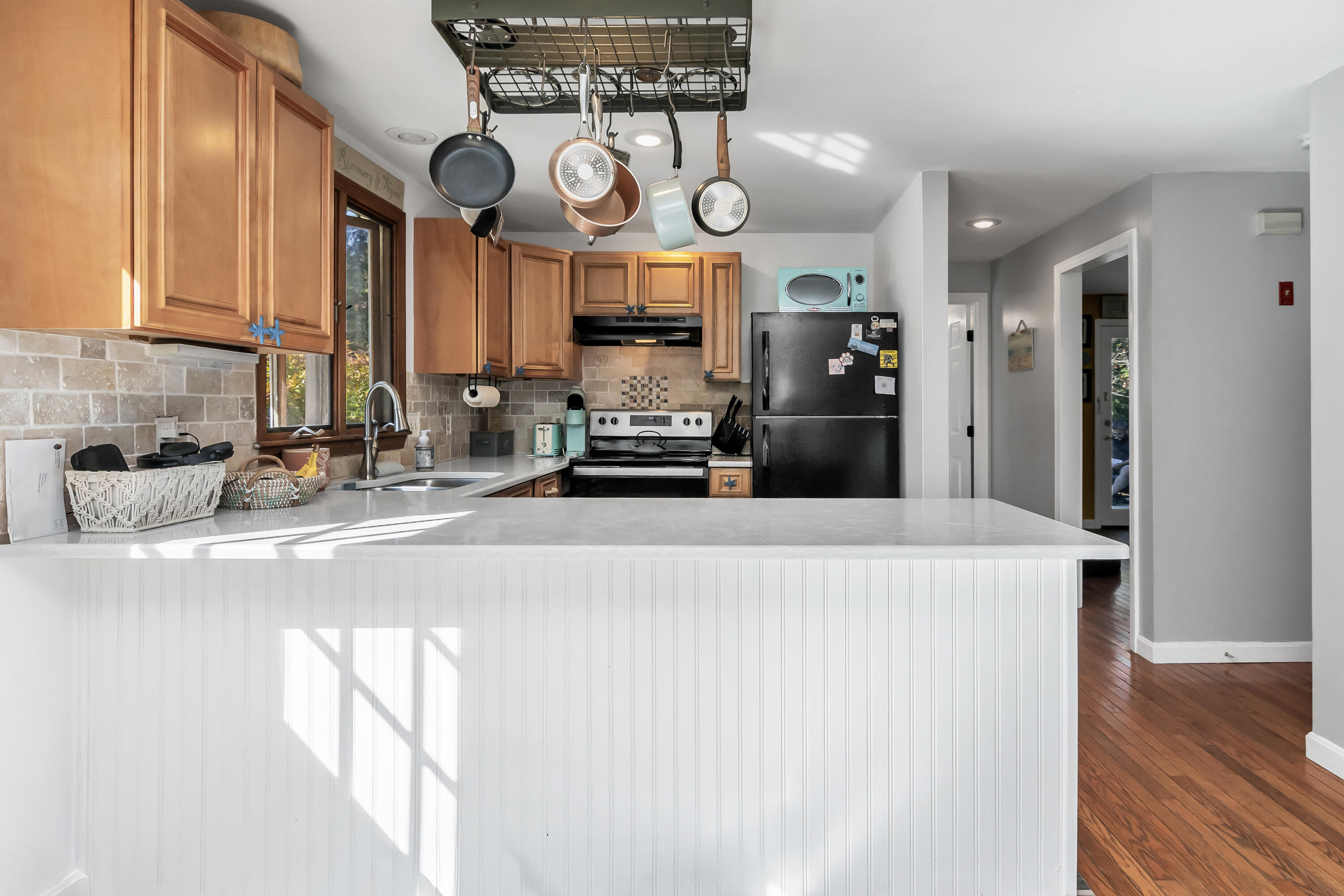 76 Trout Brook Road Mashpee, MA 02649 - Photo 16 of 43 a kitchen with stainless steel appliances granite countertop a stove a refrigerator and a white cabinets