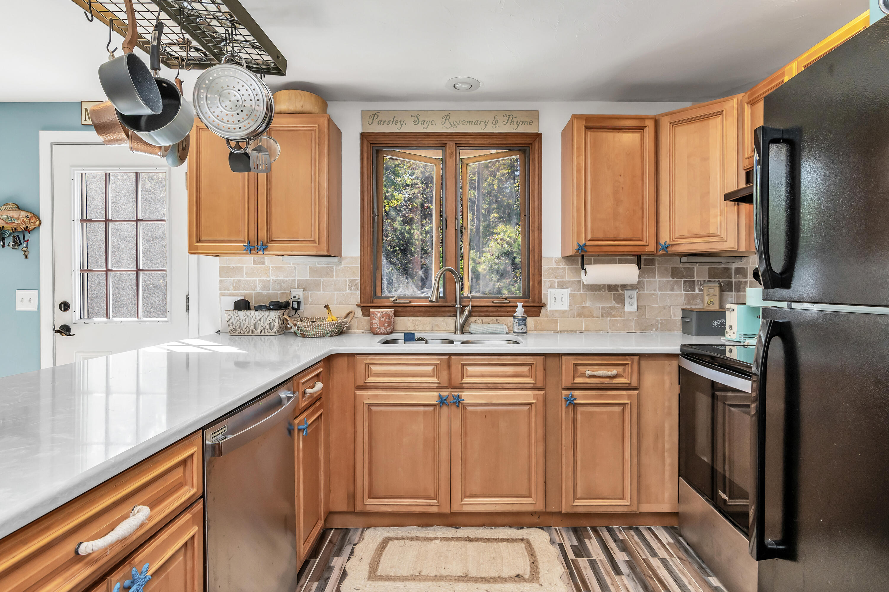 76 Trout Brook Road Mashpee, MA 02649 - Photo 18 of 43 a kitchen with stainless steel appliances granite countertop a sink a stove and a refrigerator