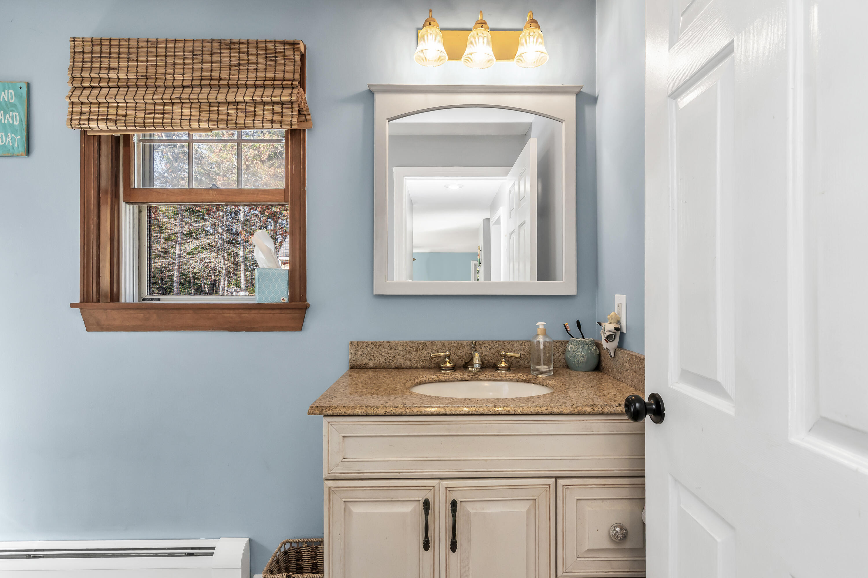 76 Trout Brook Road Mashpee, MA 02649 - Photo 20 of 43 a bathroom with a toilet sink and mirror