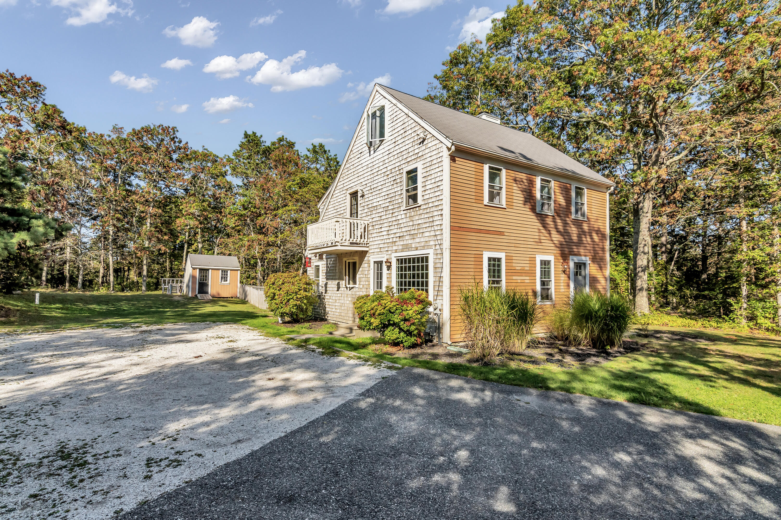 76 Trout Brook Road Mashpee, MA 02649 - Photo 2 of 43 a front view of a house with a yard