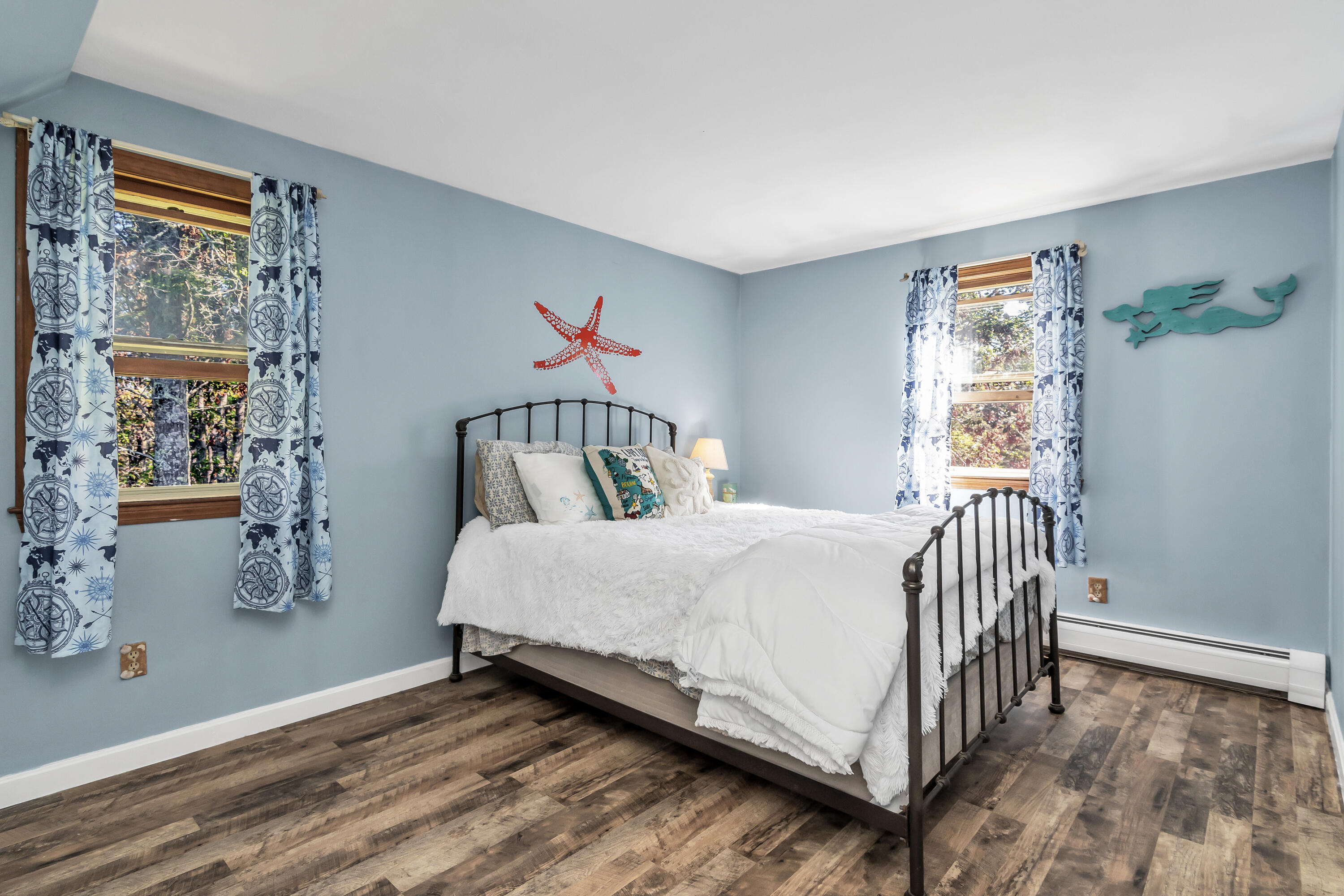 76 Trout Brook Road Mashpee, MA 02649 - Photo 22 of 43 a bedroom with a bed and a painting on the wall