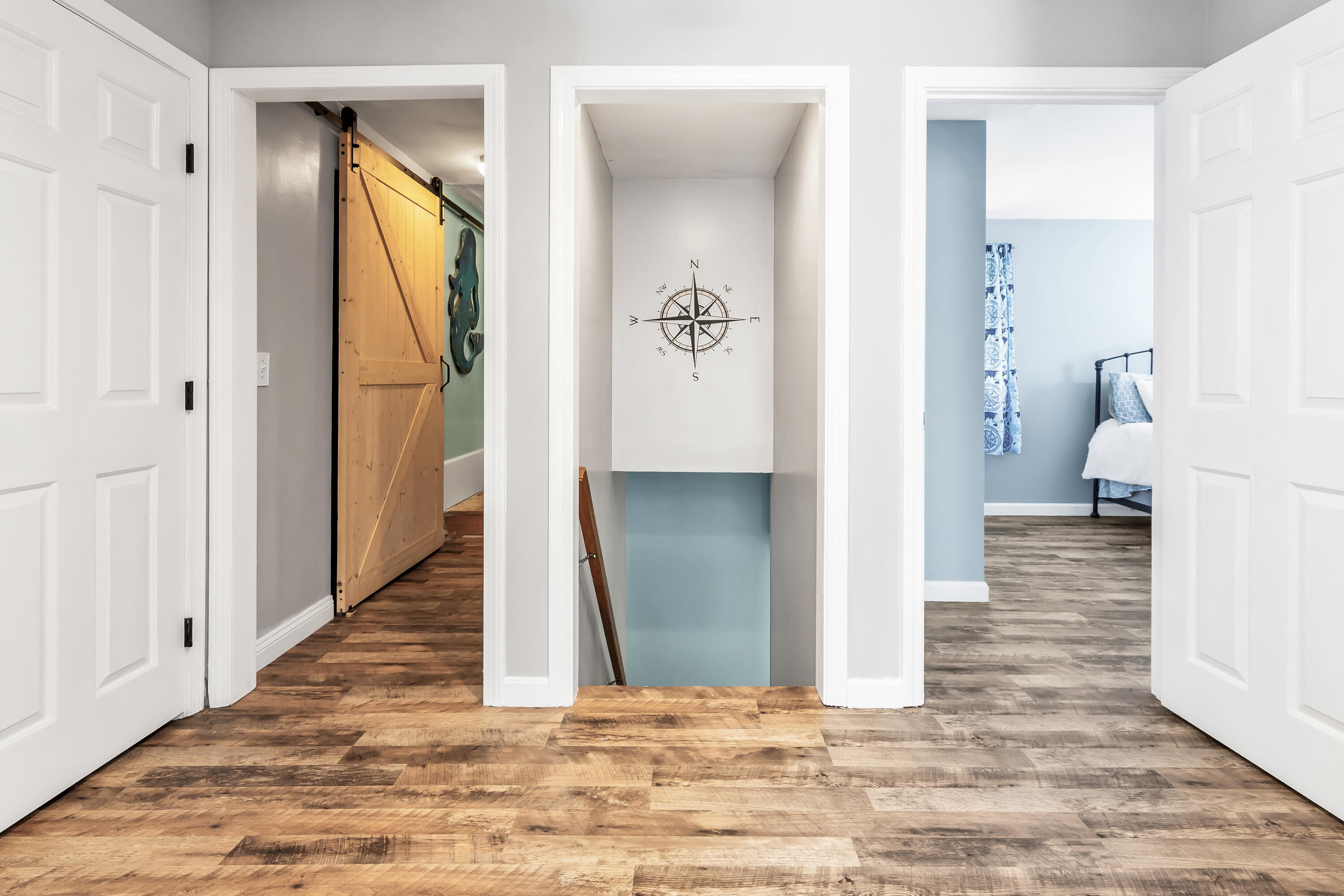 76 Trout Brook Road Mashpee, MA 02649 - Photo 25 of 43 a view of a hallway with wooden floor and a living room