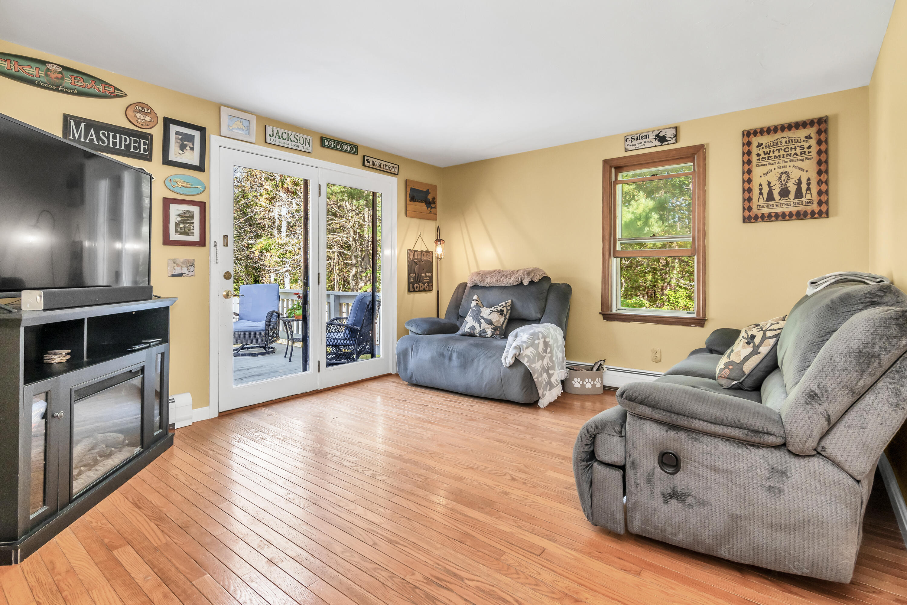 76 Trout Brook Road Mashpee, MA 02649 - Photo 30 of 43 a living room with furniture and a fireplace