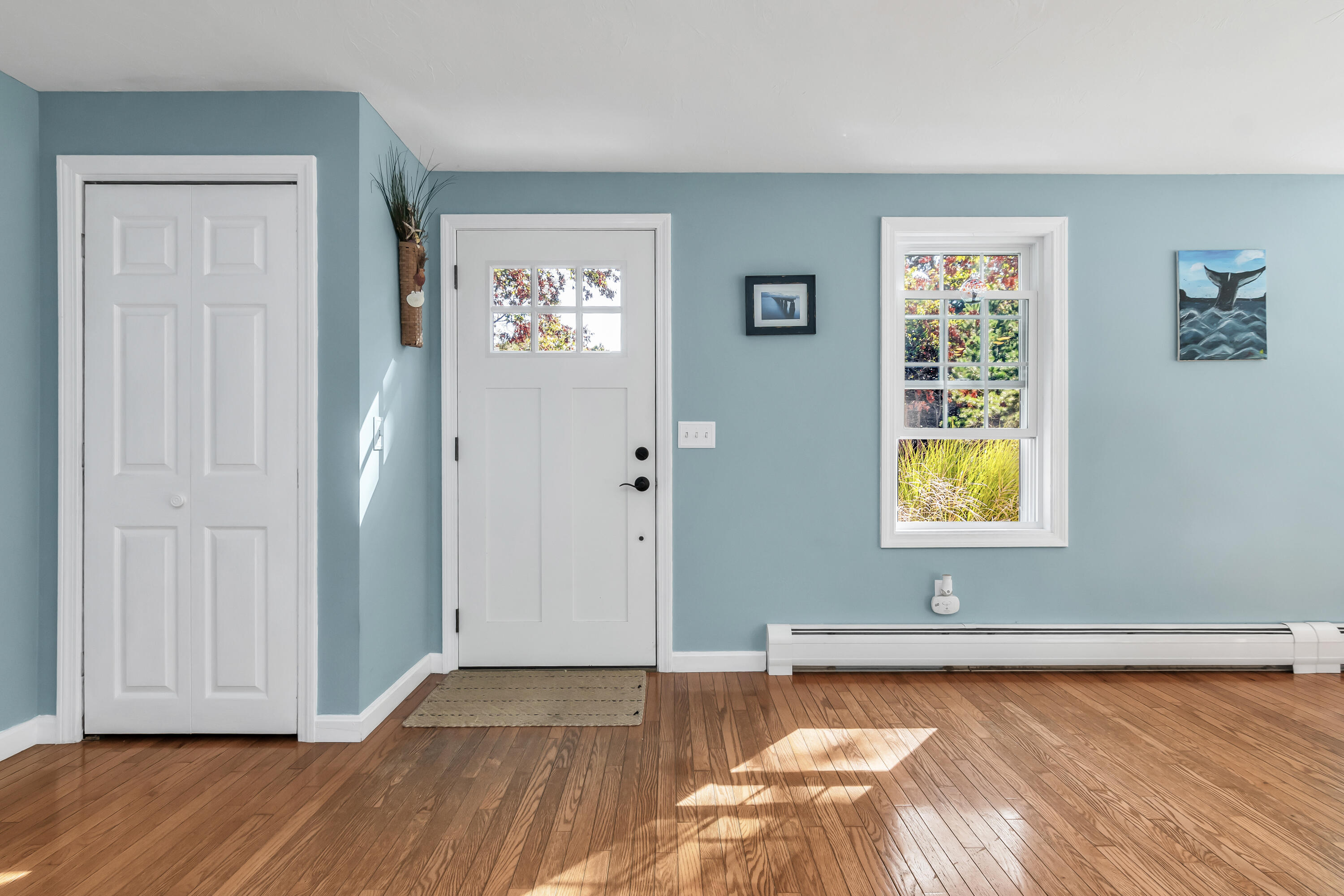 76 Trout Brook Road Mashpee, MA 02649 - Photo 10 of 43 an empty room with window and wooden floor