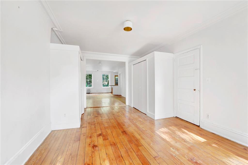 398 Henry Street Brooklyn, NY 11201 - Photo 11 of 14 a view of a room with wooden floor and a window