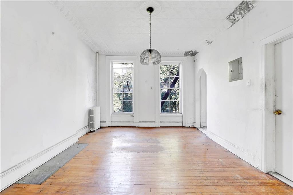 398 Henry Street Brooklyn, NY 11201 - Photo 3 of 14 a view of big room with wooden floor and windows