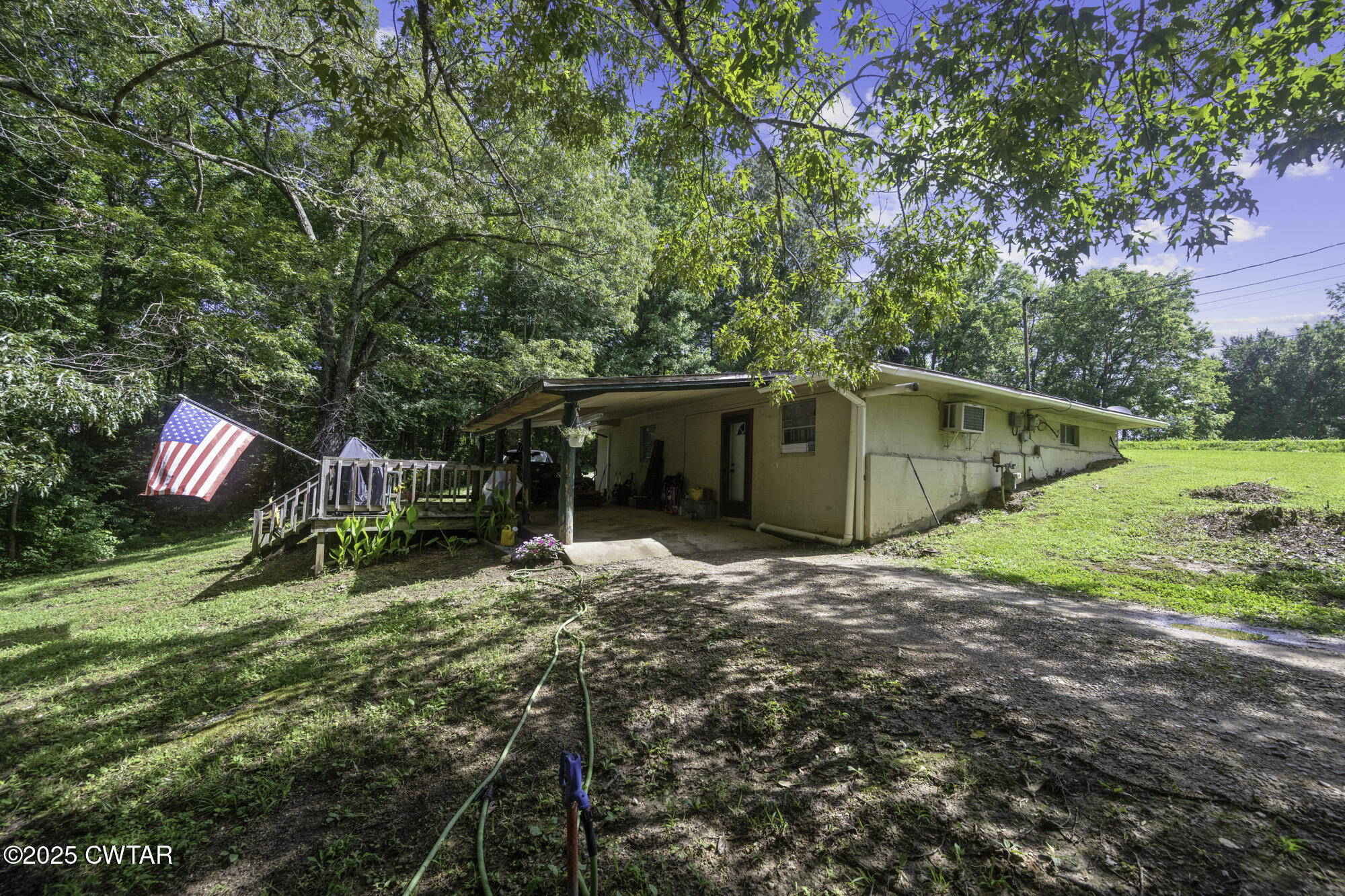 a backyard of a house with portable swimming pool and basket ball court