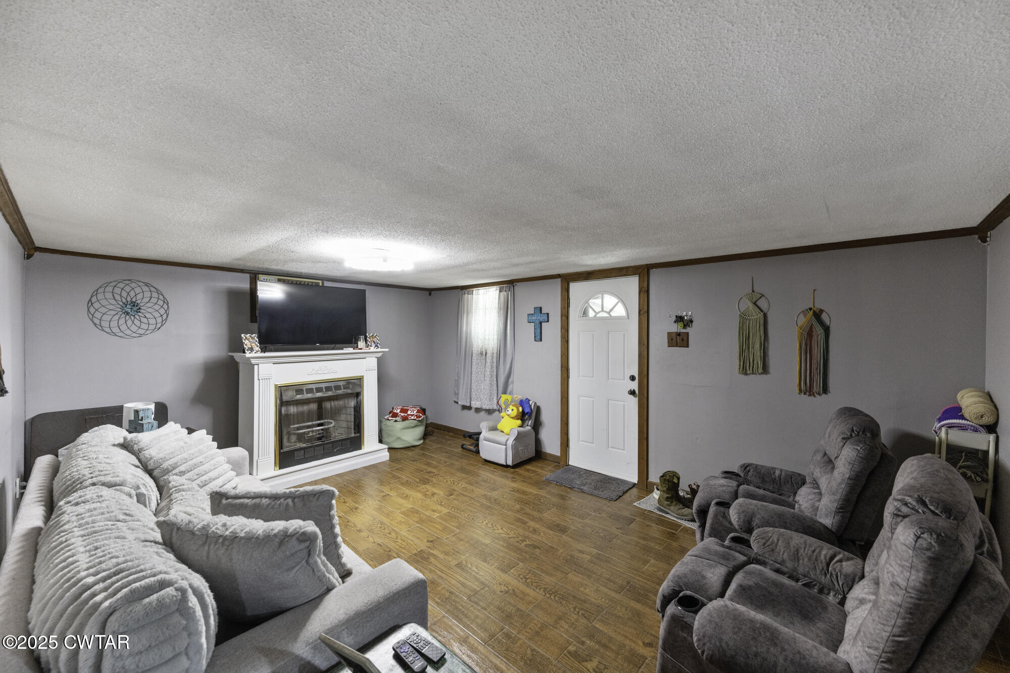 185 Corinth Road Darden, TN 38328 - Photo 6 of 8 a living room with furniture and a flat screen tv