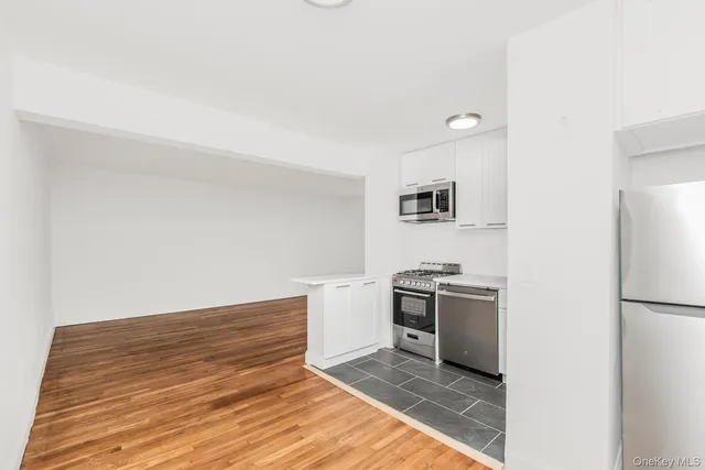 a kitchen with a stove and a refrigerator