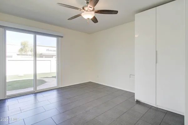 a view of an empty room with a window