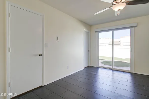 a bathroom with a toilet sink vanity and mirror