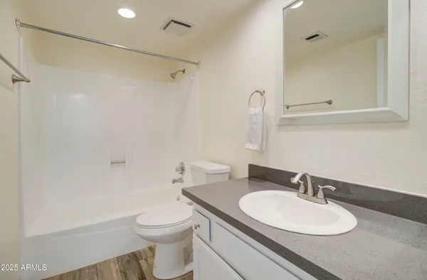 a view of an house with backyard space and balcony