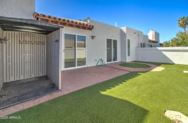 a view of a backyard with sitting area