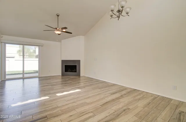 a swimming pool with outdoor seating and yard