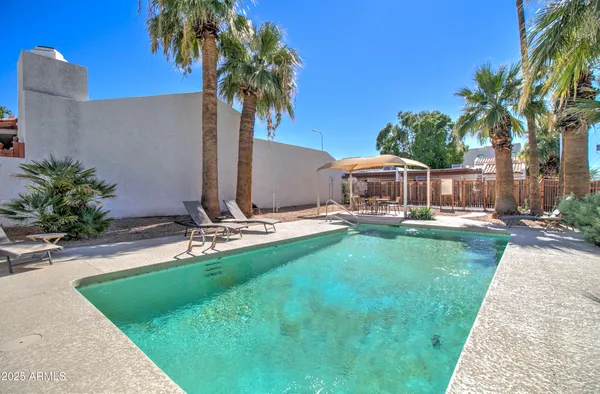 swimming pool view with a outdoor seating