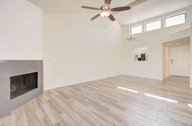 a kitchen with granite countertop white cabinets stainless steel appliances and sink