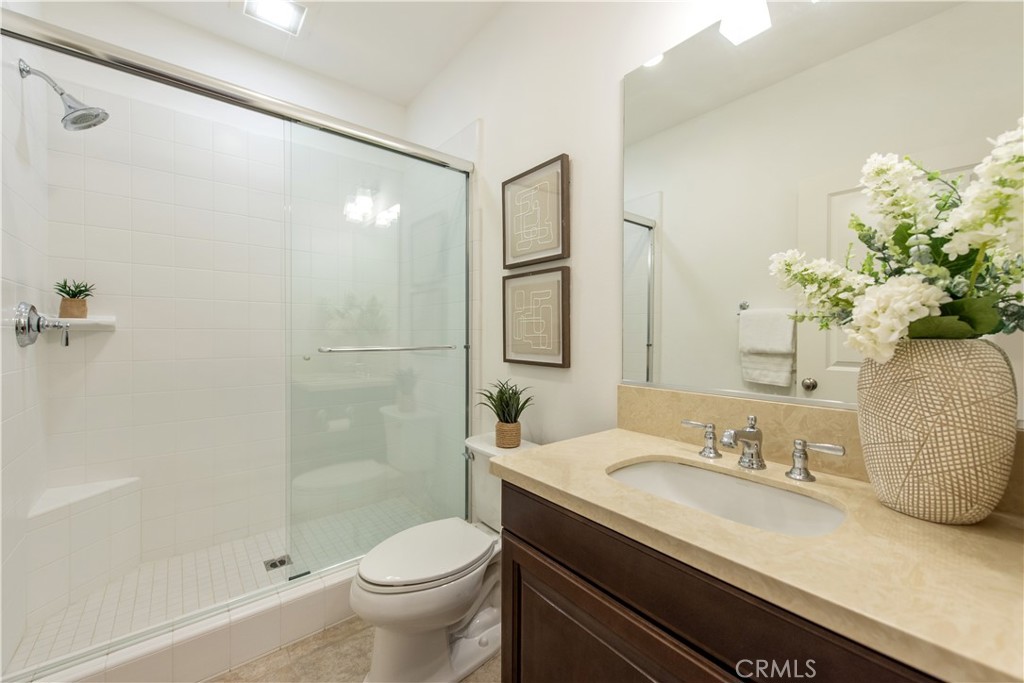 238 Shelbourne Irvine, CA 92620 - Photo 11 of 36 a bathroom with a granite countertop sink toilet and shower