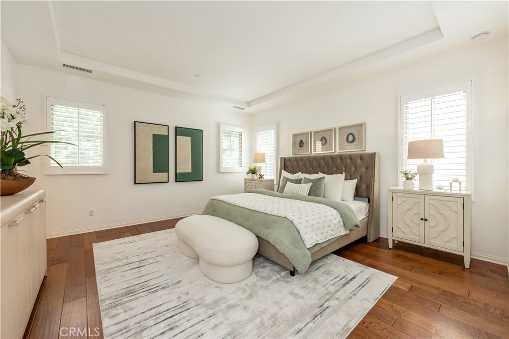 238 Shelbourne Irvine, CA 92620 - Photo 13 of 36 a bedroom with a bed and wooden floor