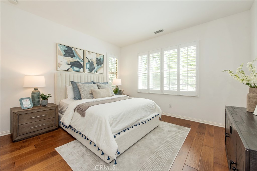 238 Shelbourne Irvine, CA 92620 - Photo 18 of 36 a bedroom with a large bed and a window