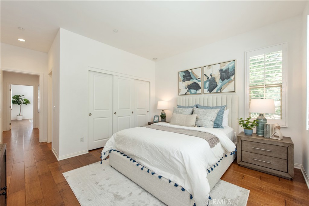 238 Shelbourne Irvine, CA 92620 - Photo 19 of 36 a bedroom with a bed and a painting on the wall