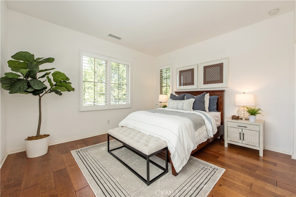 238 Shelbourne Irvine, CA 92620 - Photo 21 of 36 a bedroom with a bed a dresser and window
