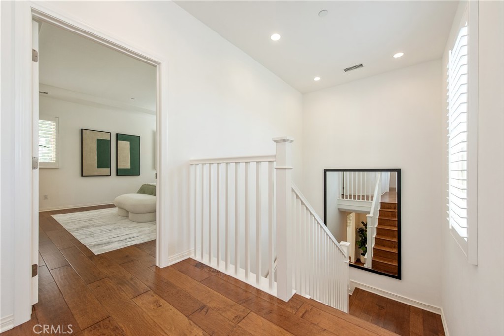 238 Shelbourne Irvine, CA 92620 - Photo 26 of 36 a view of entryway and hall with wooden floor