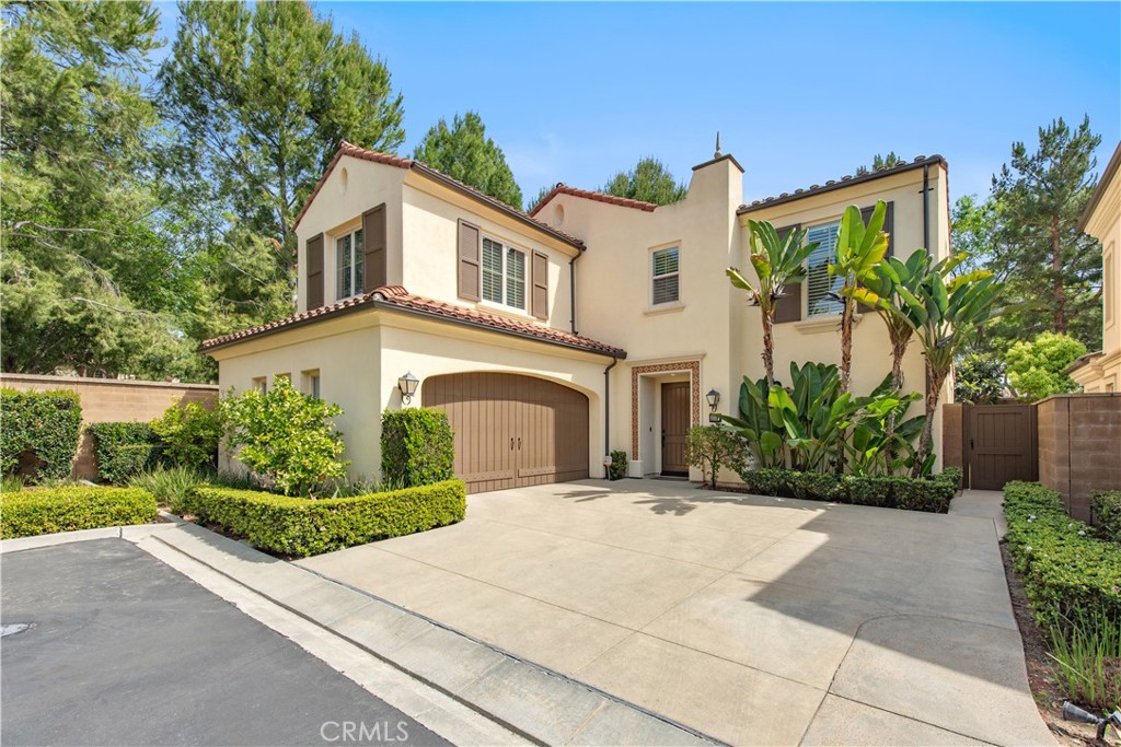 238 Shelbourne Irvine, CA 92620 - Photo 29 of 36 a front view of a house with a yard and potted plants