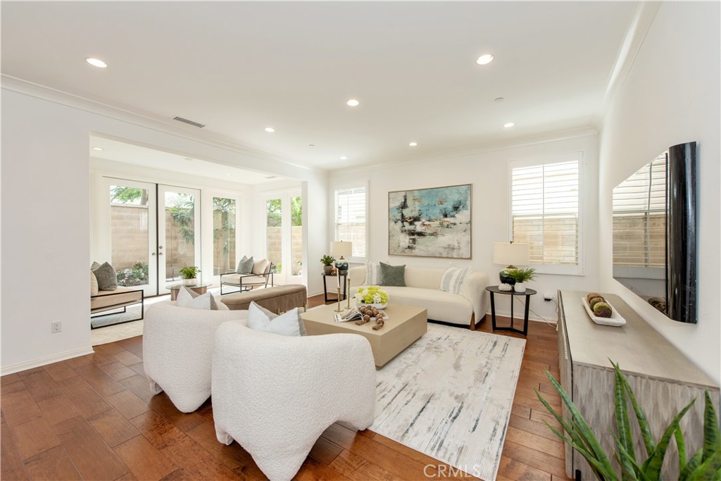 238 Shelbourne Irvine, CA 92620 - Photo 3 of 36 a living room with fireplace furniture and a flat screen tv