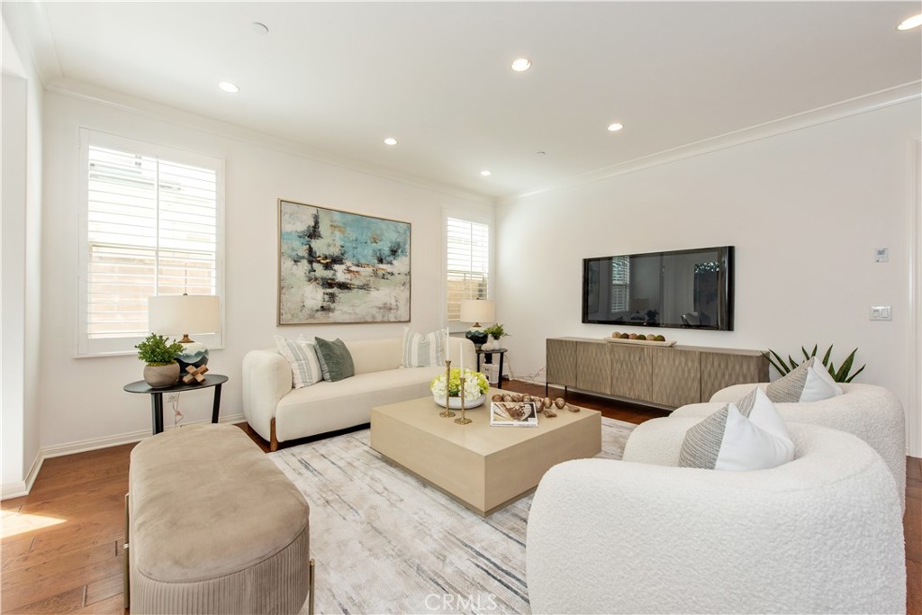 238 Shelbourne Irvine, CA 92620 - Photo 5 of 36 a living room with furniture and a flat screen tv