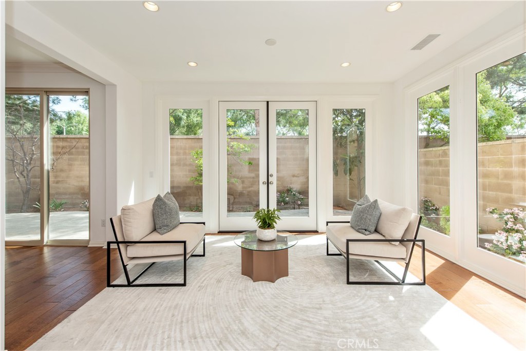 238 Shelbourne Irvine, CA 92620 - Photo 6 of 36 a living room with furniture and a potted plant